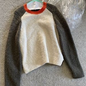plush colorblock sweater in size L. Cream front, olive back, dark orange.